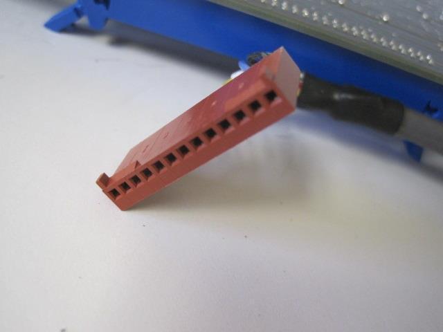 a piece of red plastic sitting on top of a table