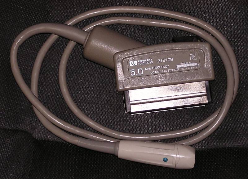 a close up of a probe wrapped around in dark room