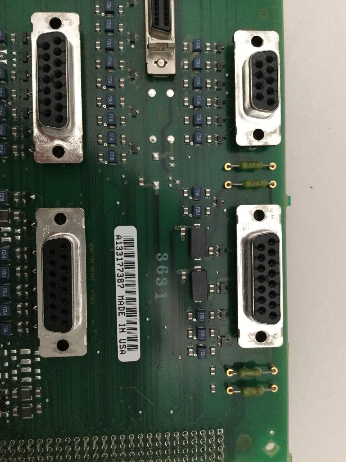 a close up of a computer board with many wires