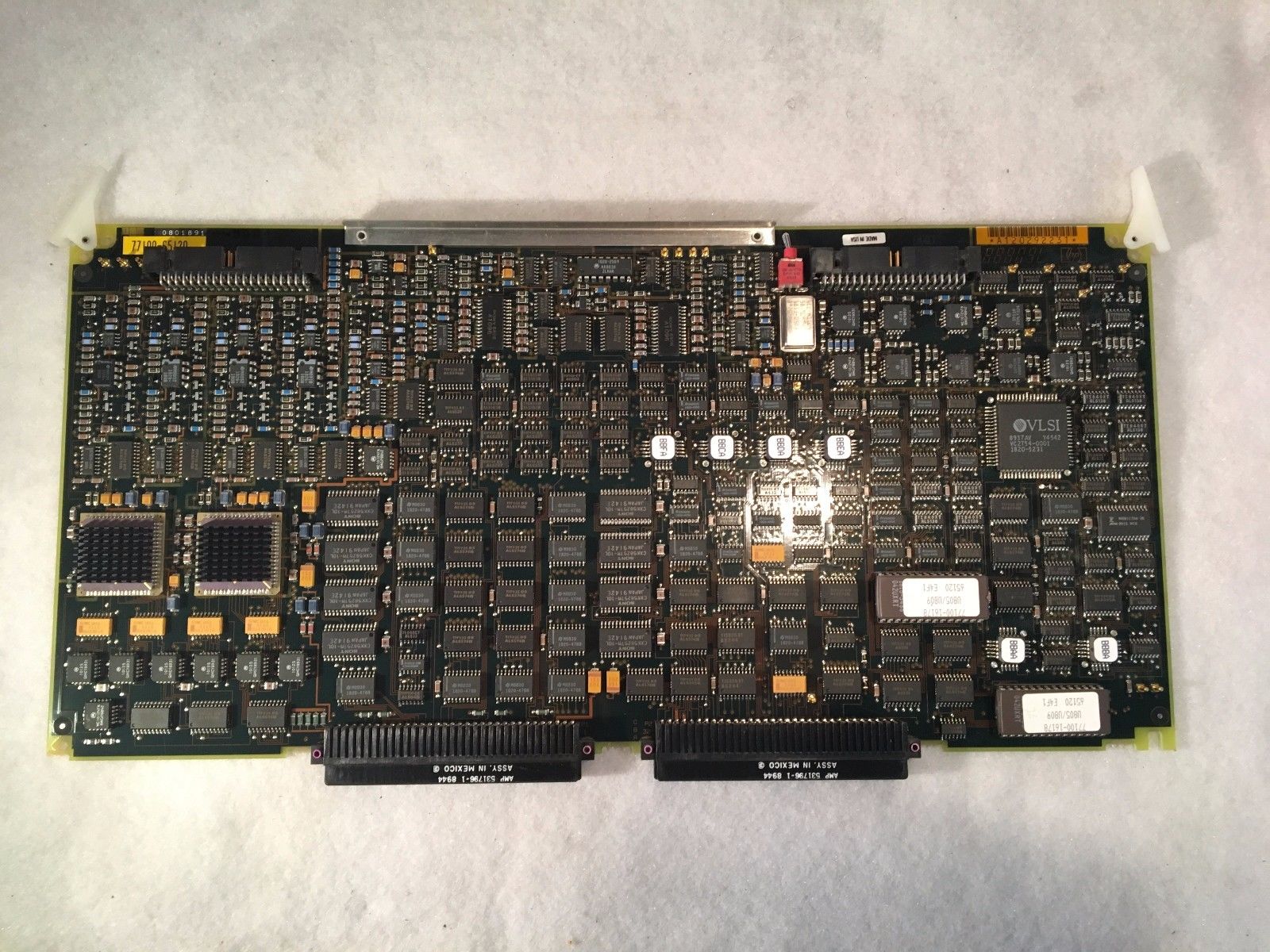 a close up of a computer motherboard on a white surface