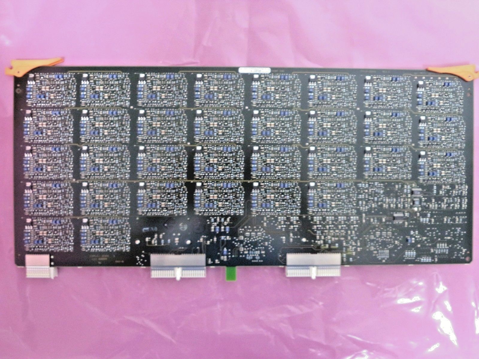 a close up of a computer board on a pink background