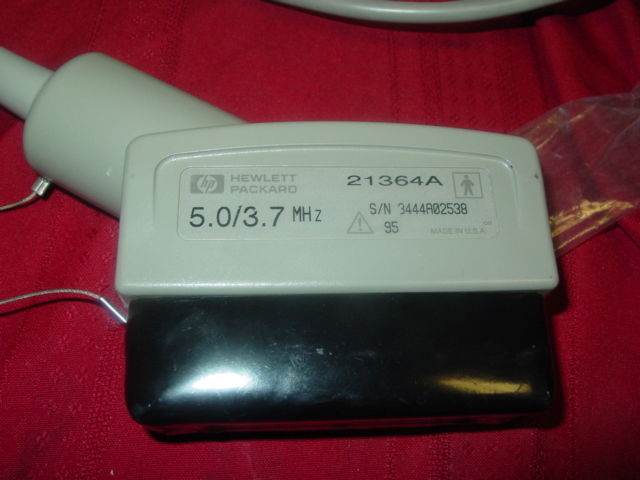 a close up of a device on a red cloth