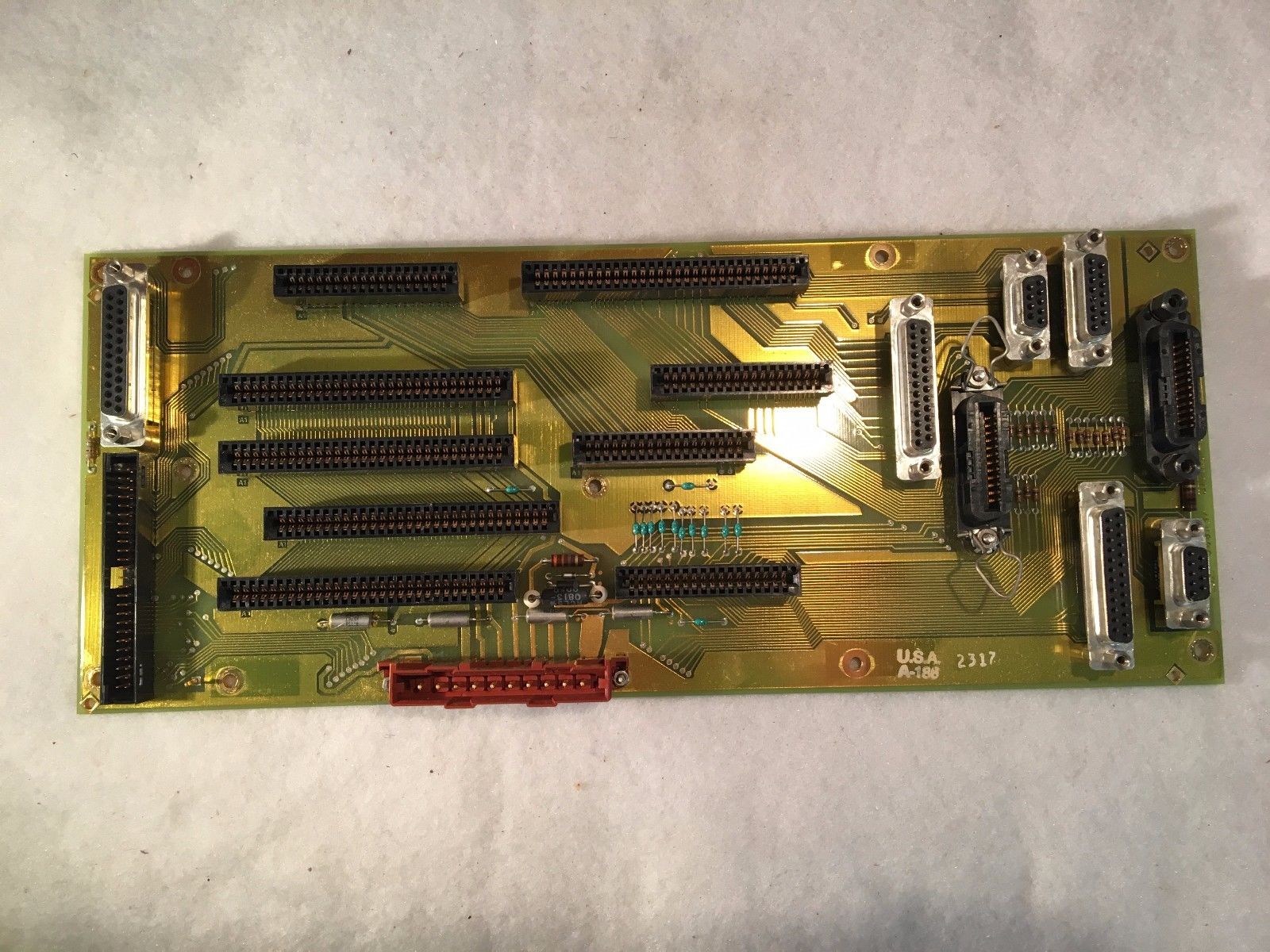 a close up of a circuit board on a white surface