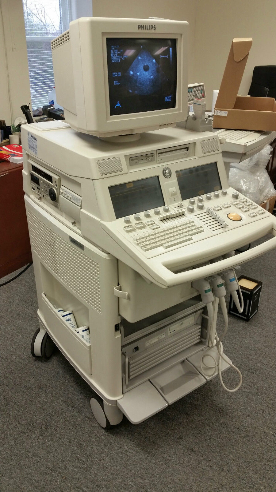 a medical machine with a monitor on top of it