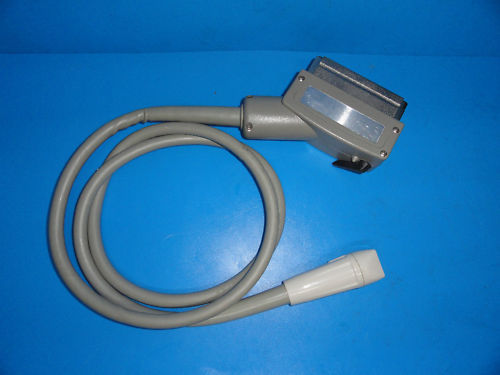 a cord connected to a device on a blue surface