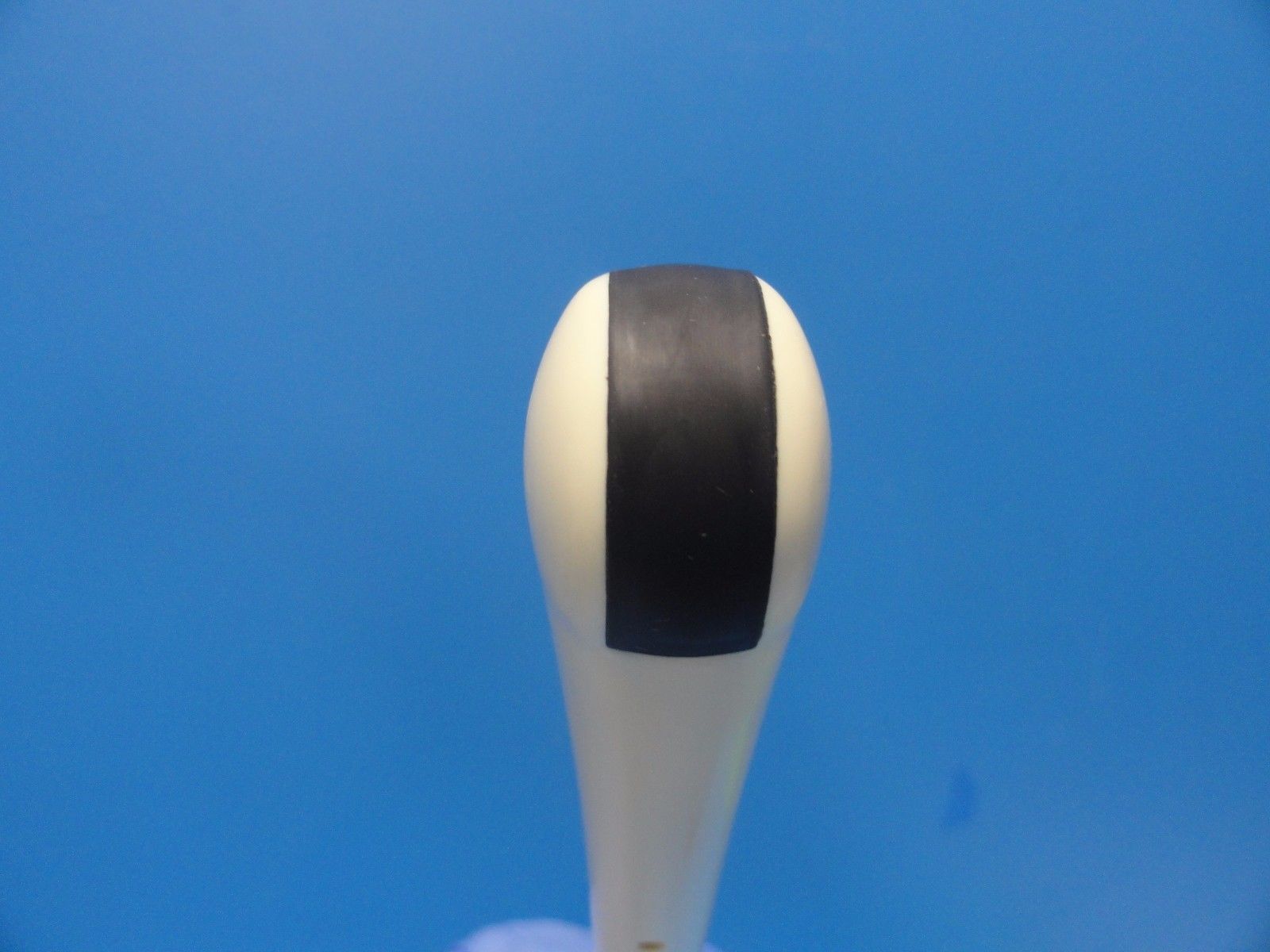 a black and white stripe probe head