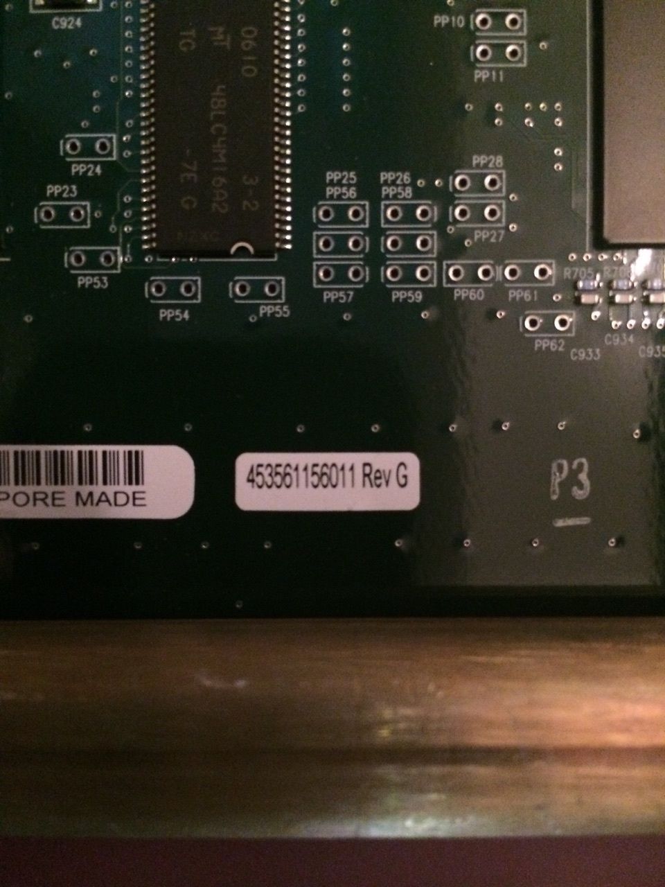 a close up of a computer board with a bar code on it