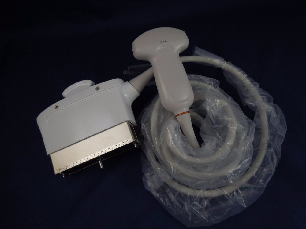 overhead shot of white probed wrapped in dark room