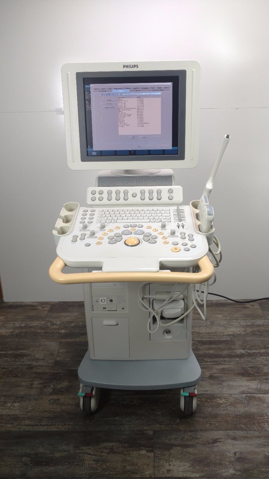 a laptop computer sitting on top of a medical cart