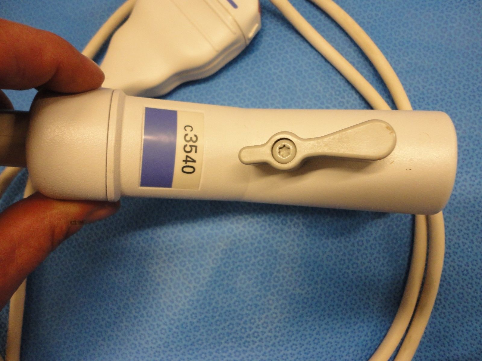 a close up of a person holding a probe