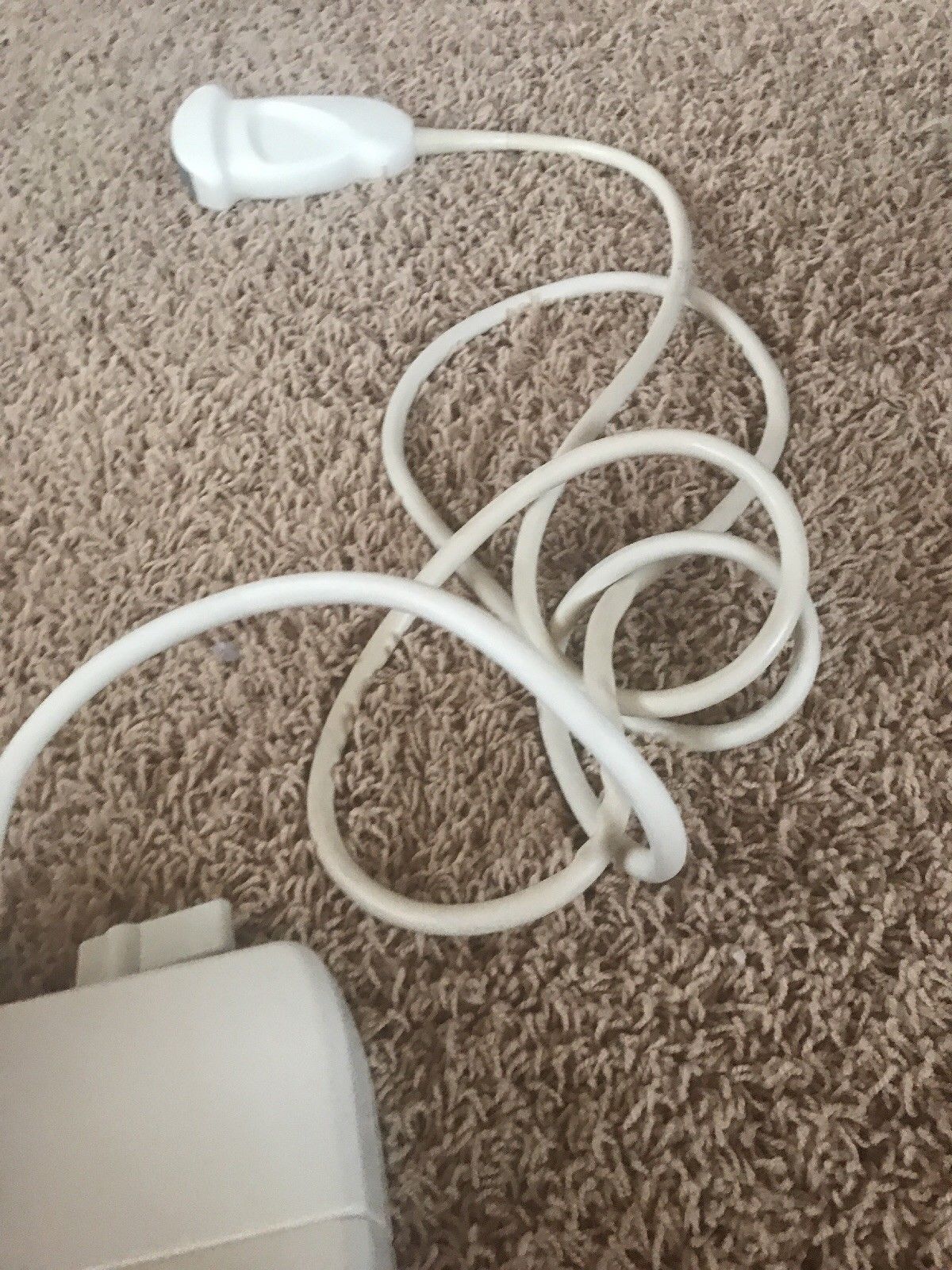 probe wire wrapped white on carpet