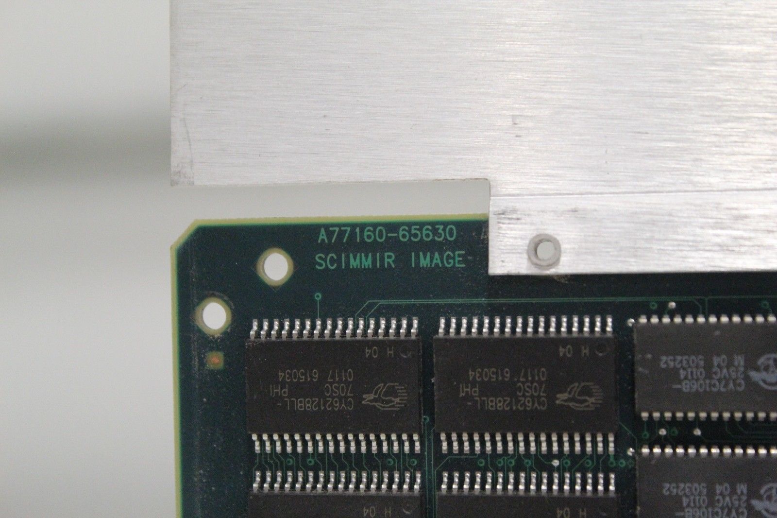 a close up of a circuit board with chip numbers