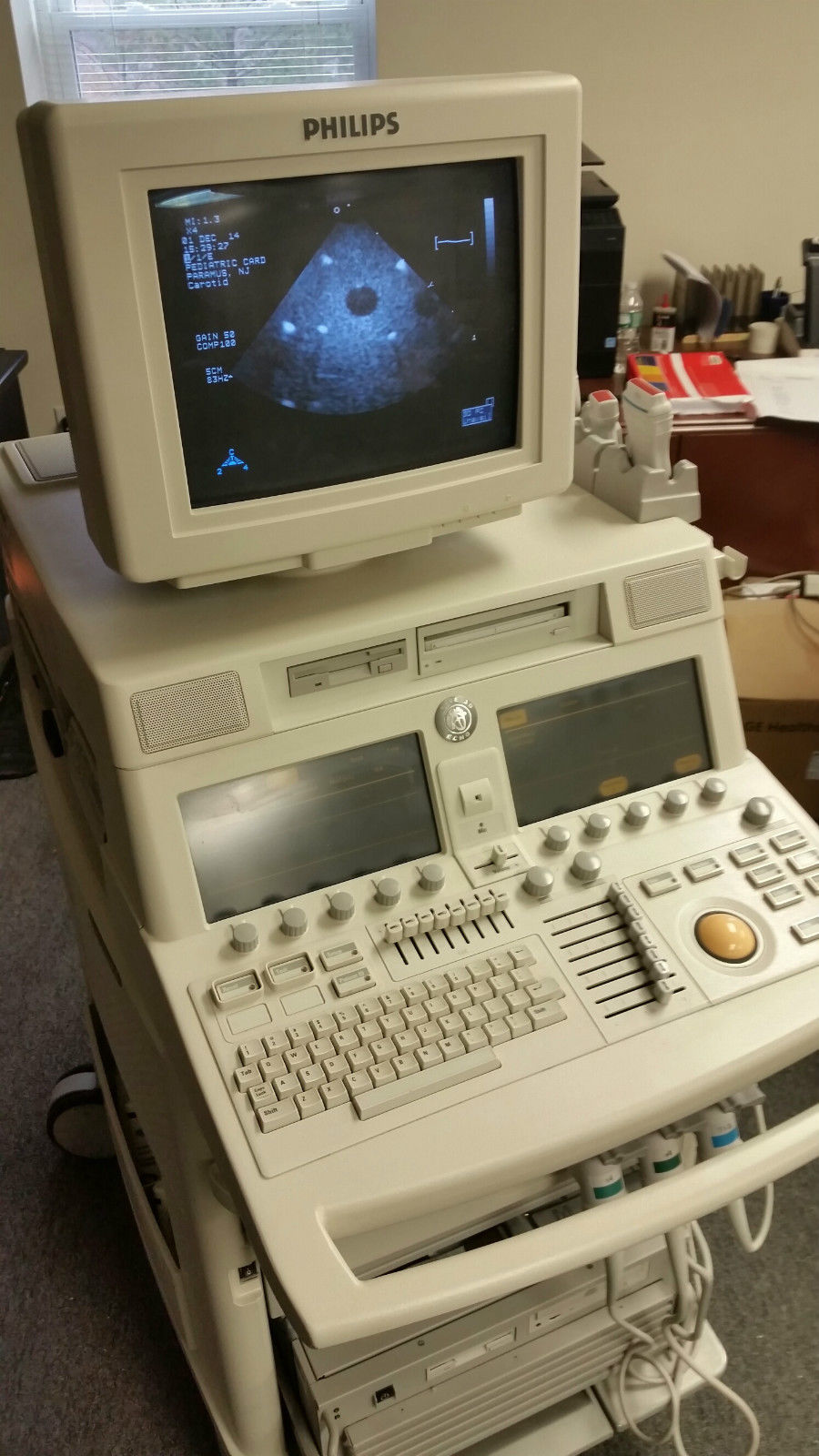 a computer monitor sitting on top of a medical machine