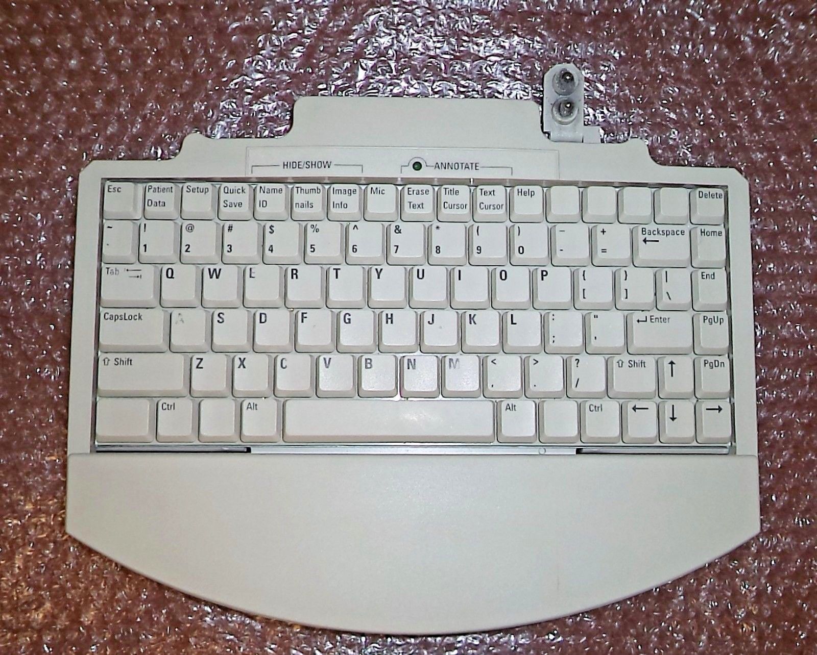 a white computer keyboard sitting on top of a table