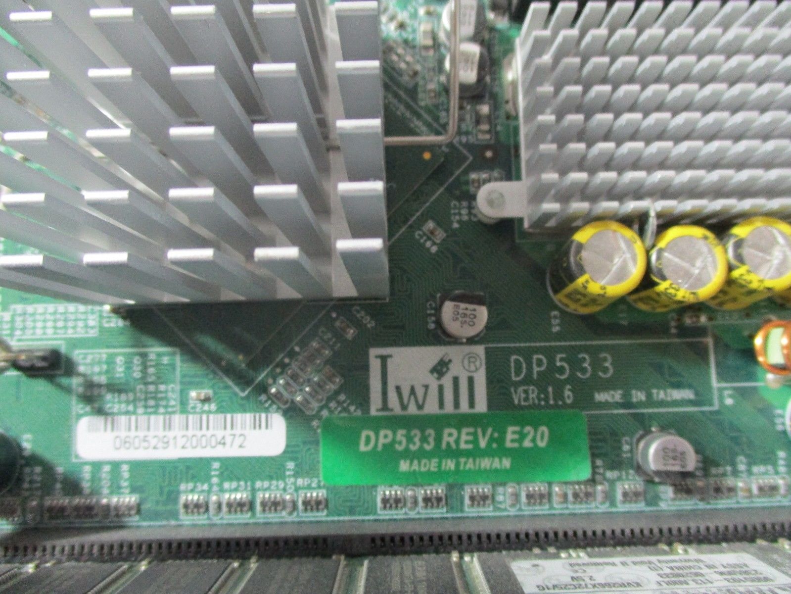 a close up of a computer motherboard with many wires