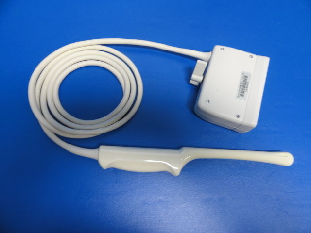a white cord connected to a device on a blue surface