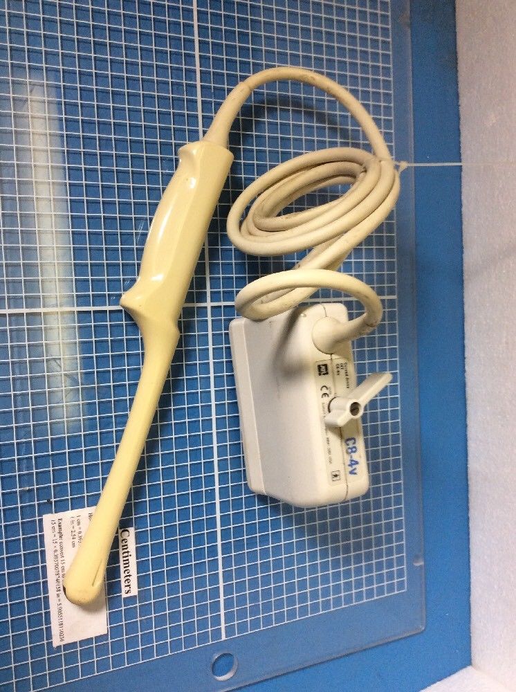 vertical shot probe electrical outlet on a blue tiled wall