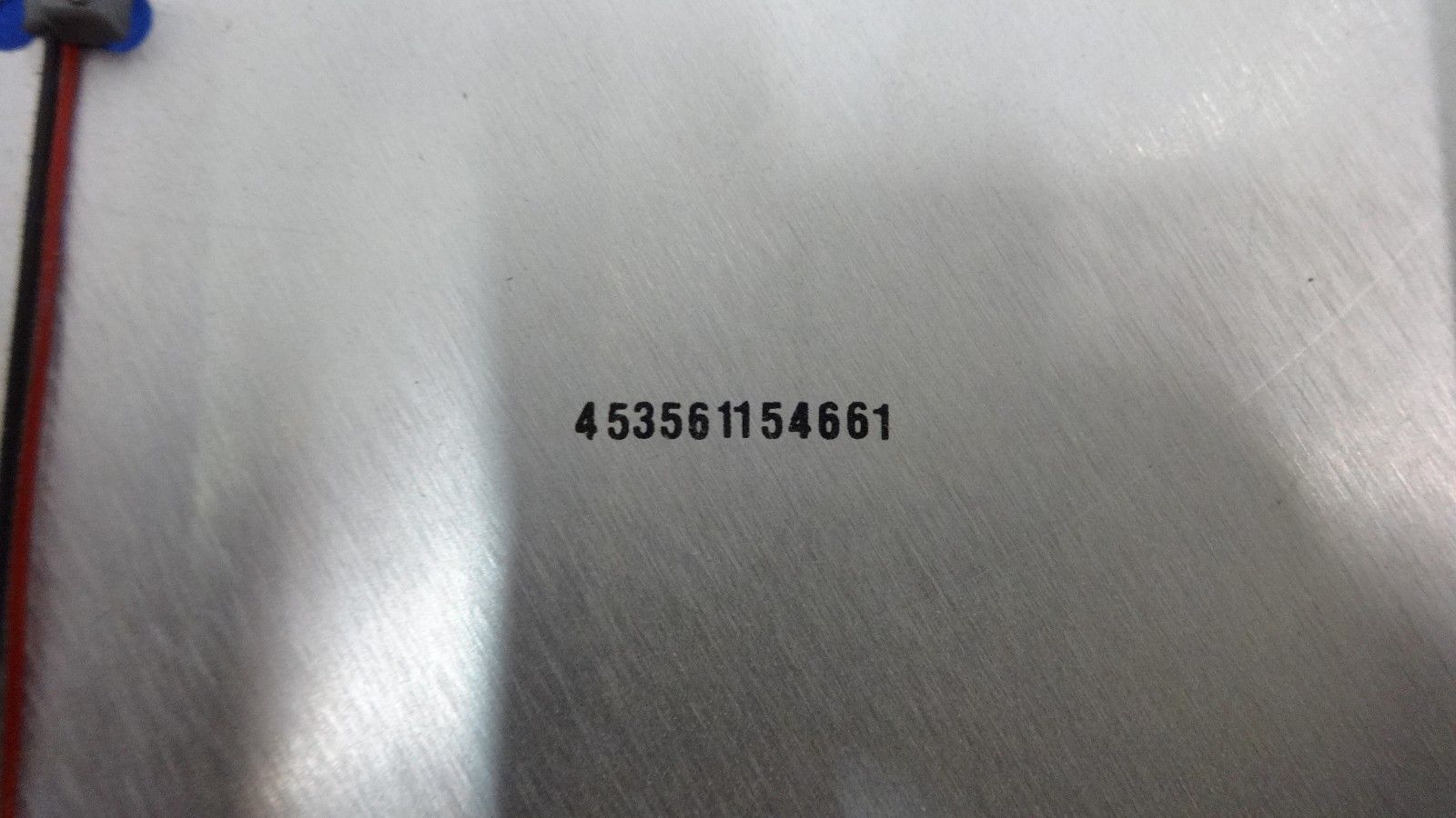 a close up of a metal surface with numbers on it