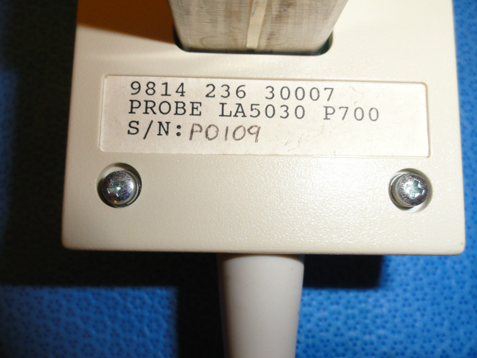 a close up of a probe with a label on it