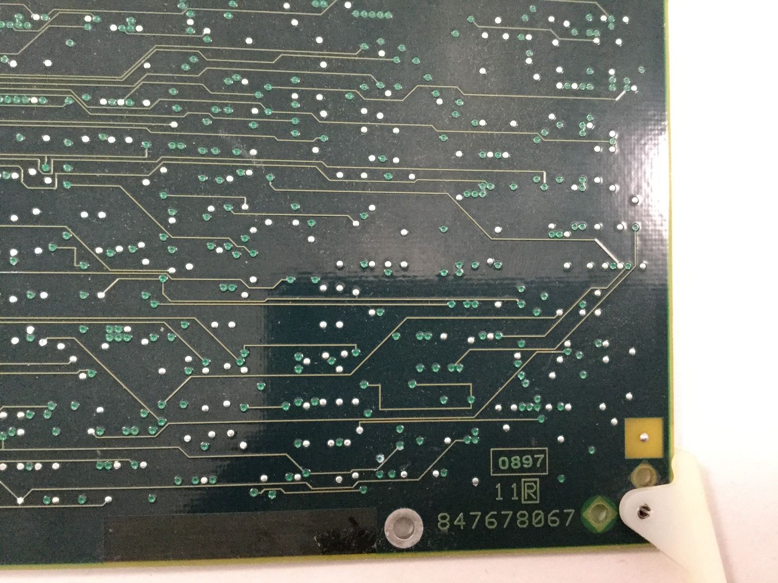 a close up of a circuit board with many dots on it