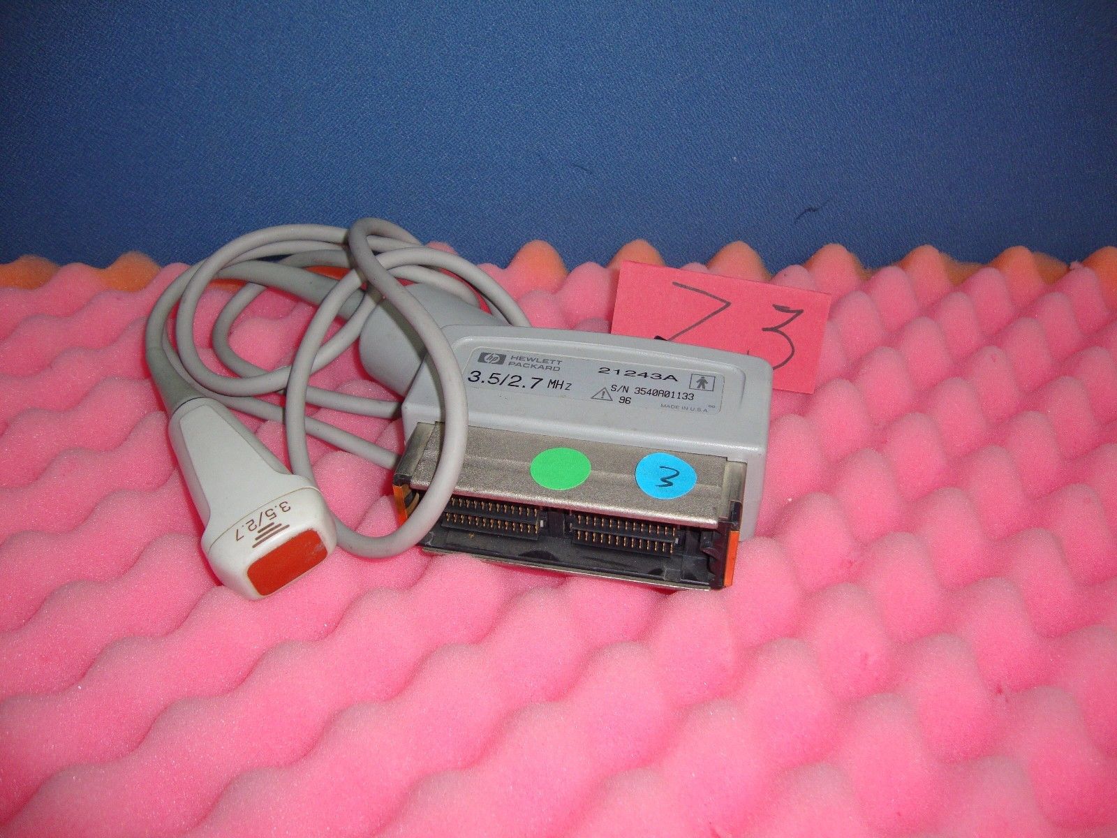a pink cake with a probe controller on top of it