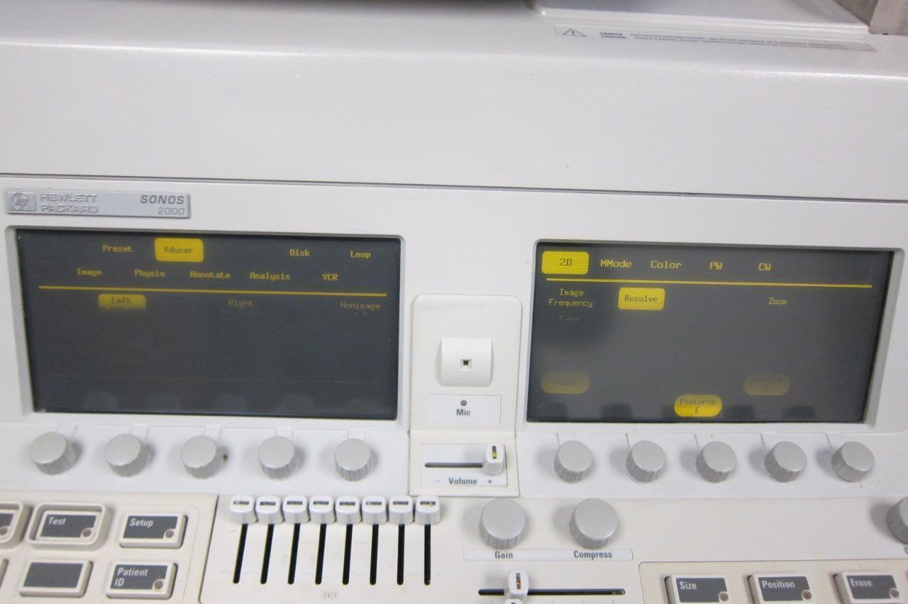 a close up of a machine with two monitors