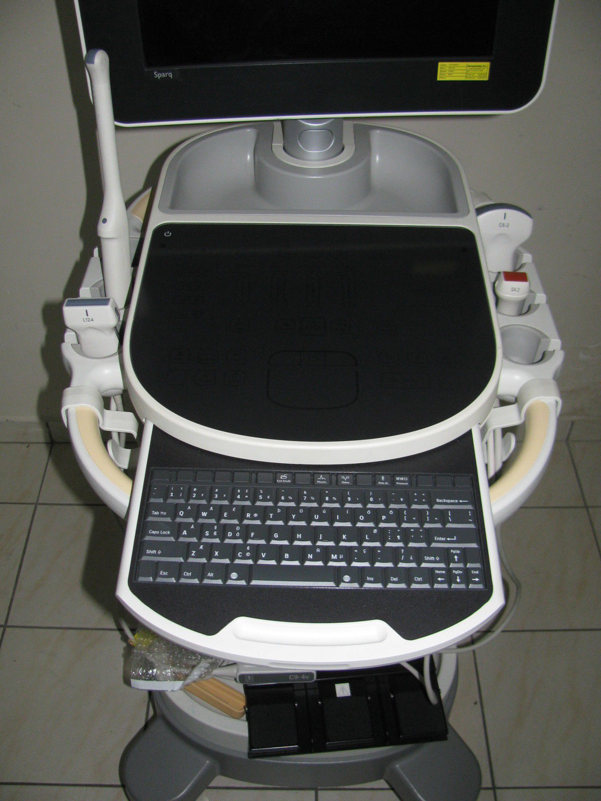 a laptop computer sitting on top of a stand