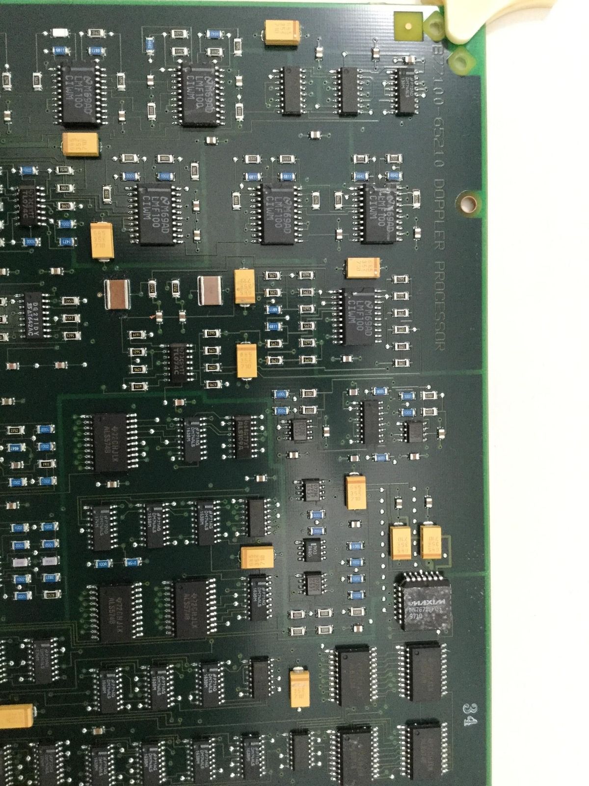 a close up of a computer board with many chip pieces