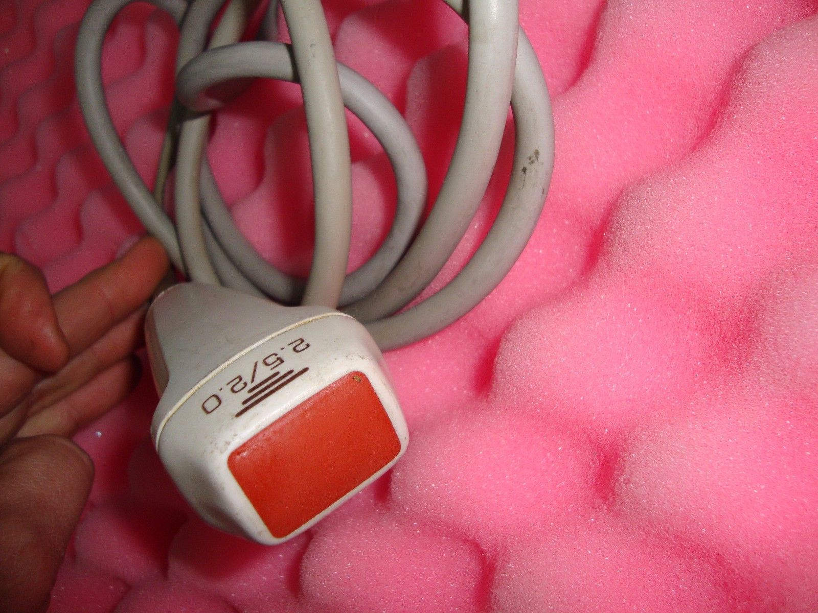 a close up of a cord connected to a device