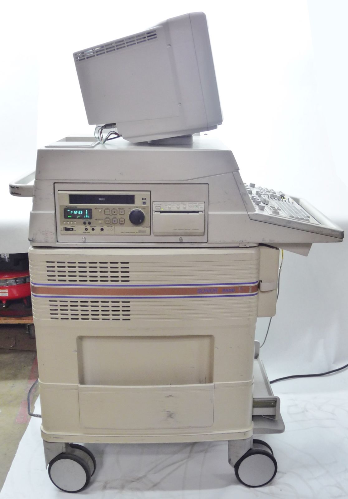 an old computer sitting on top of a cart