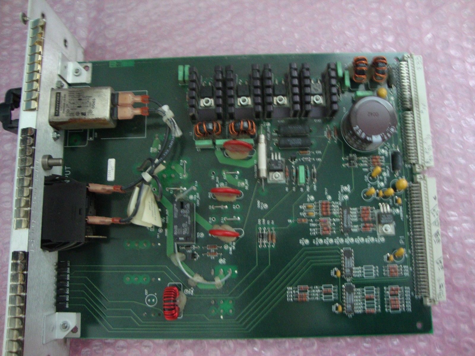 green mother board on pink table