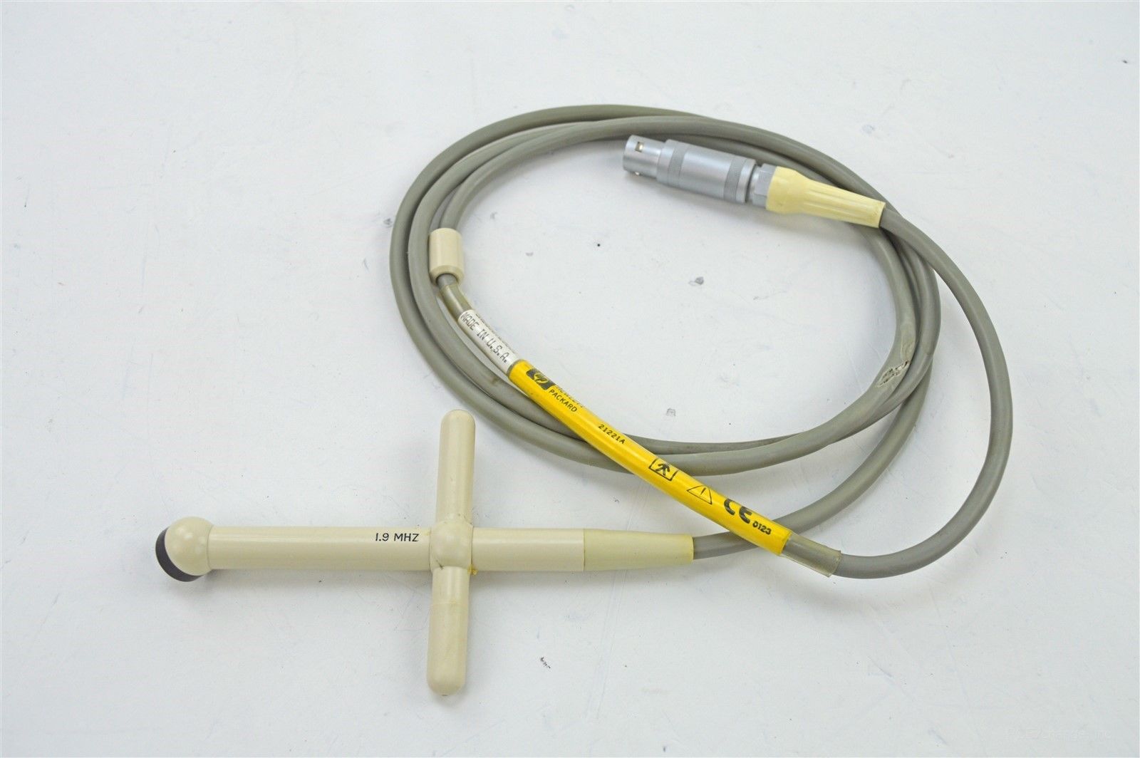 a white and yellow probe with a yellow handle