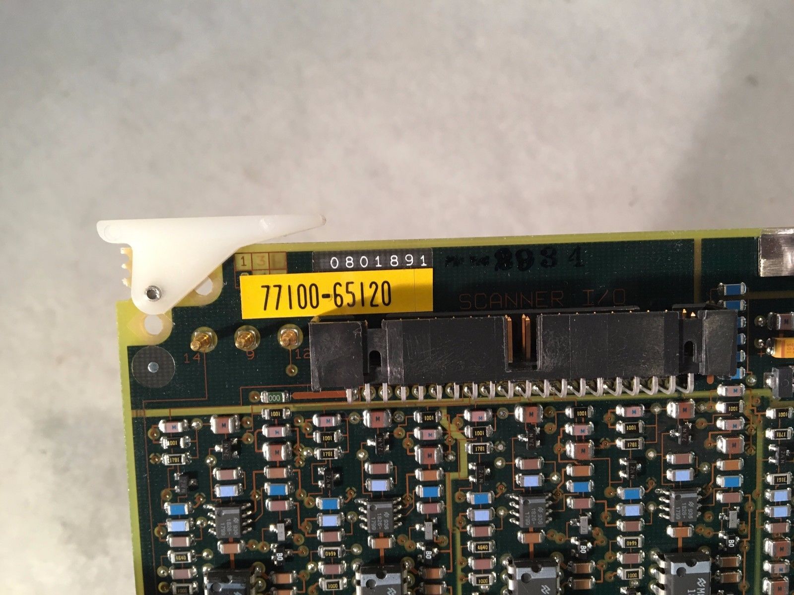 a close up of a circuit board with a yellow label on it