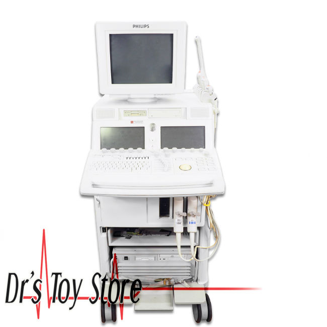 a white medical device with a monitor on top of it