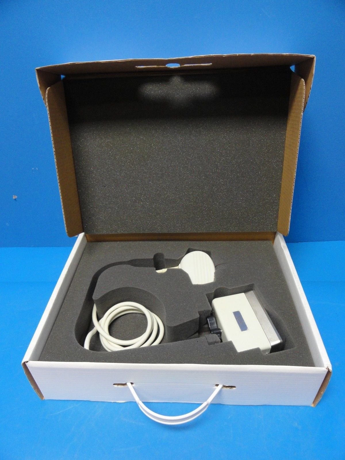 an open box containing a probe