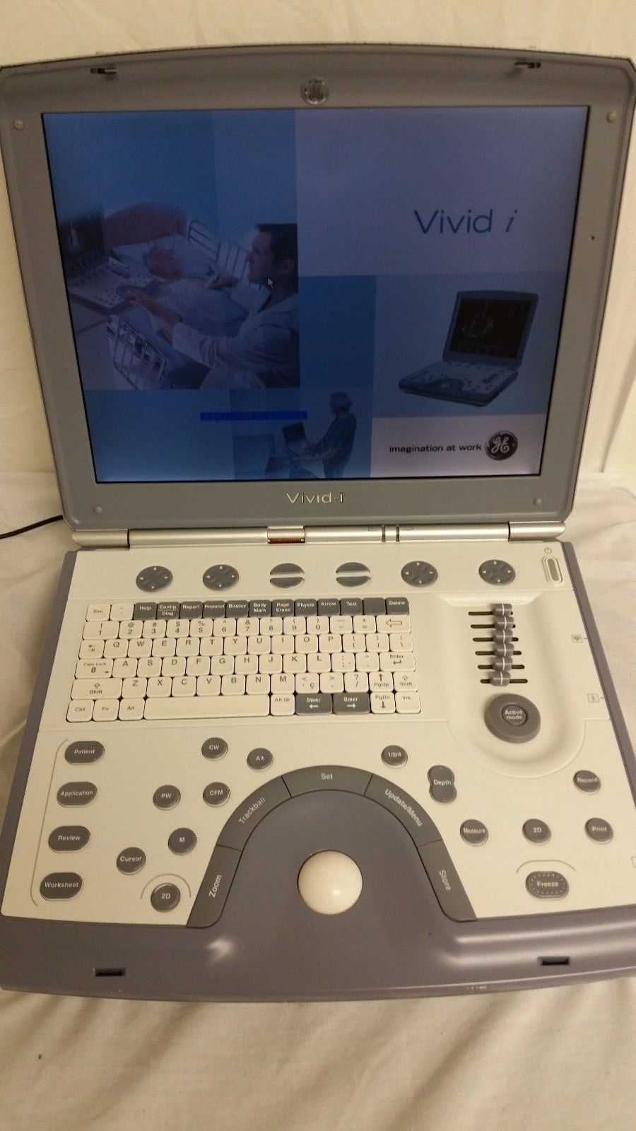portable ultrasound sitting on top of a bed