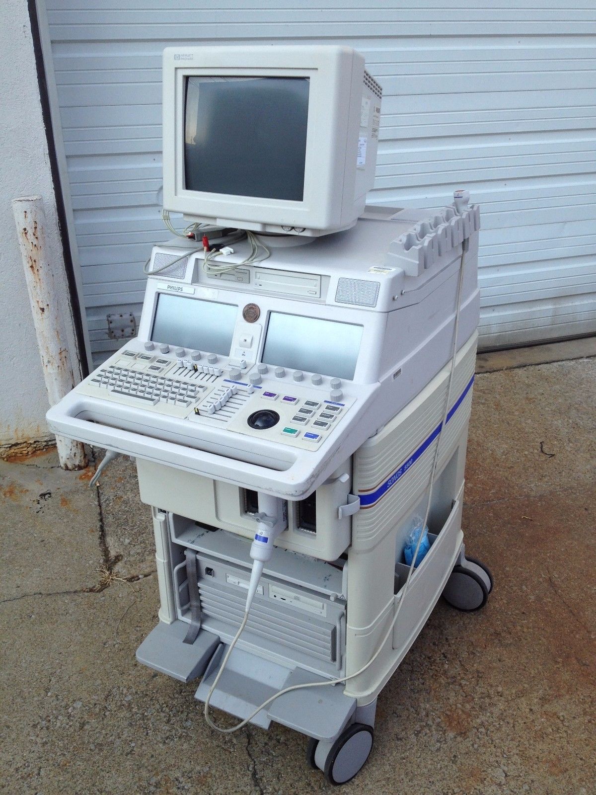 a computer sitting on top of a cart