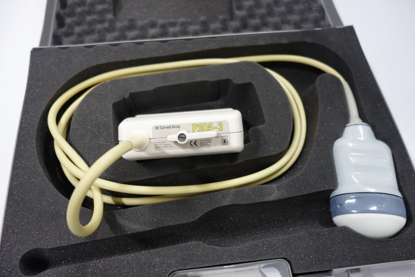 an electronic device is in a case with a cord