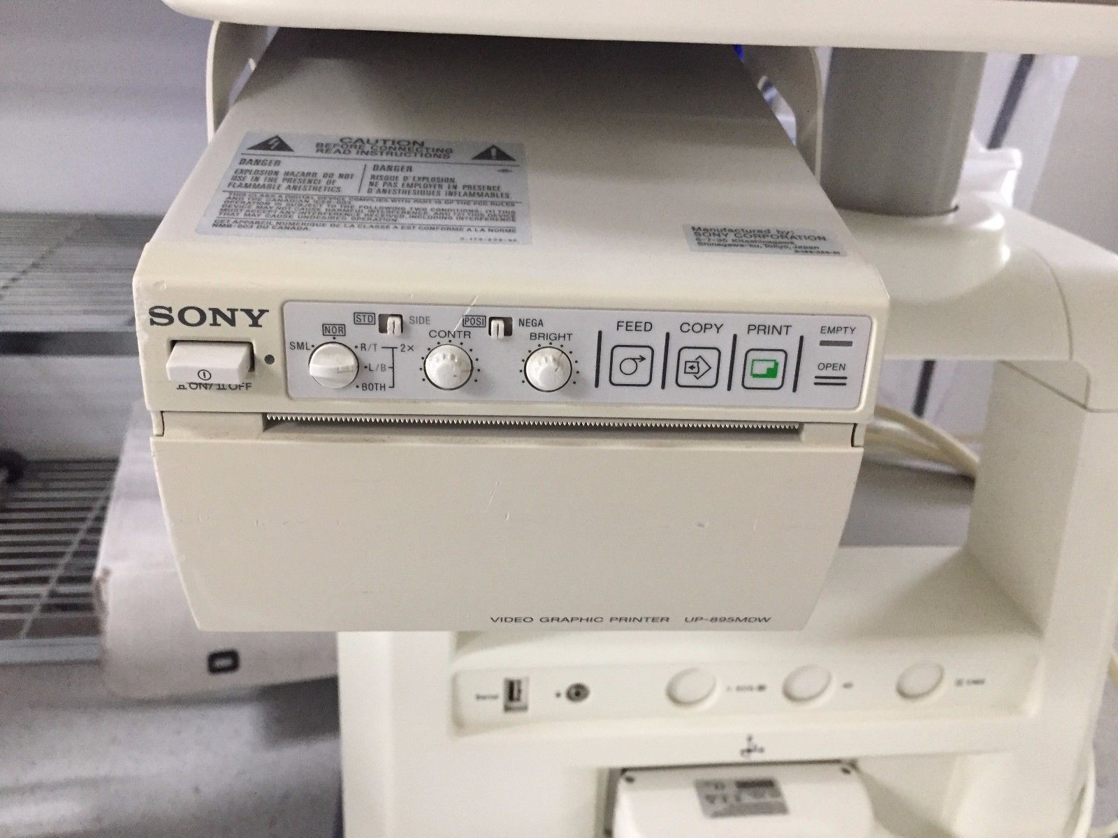 a close up of printer with buttons on it