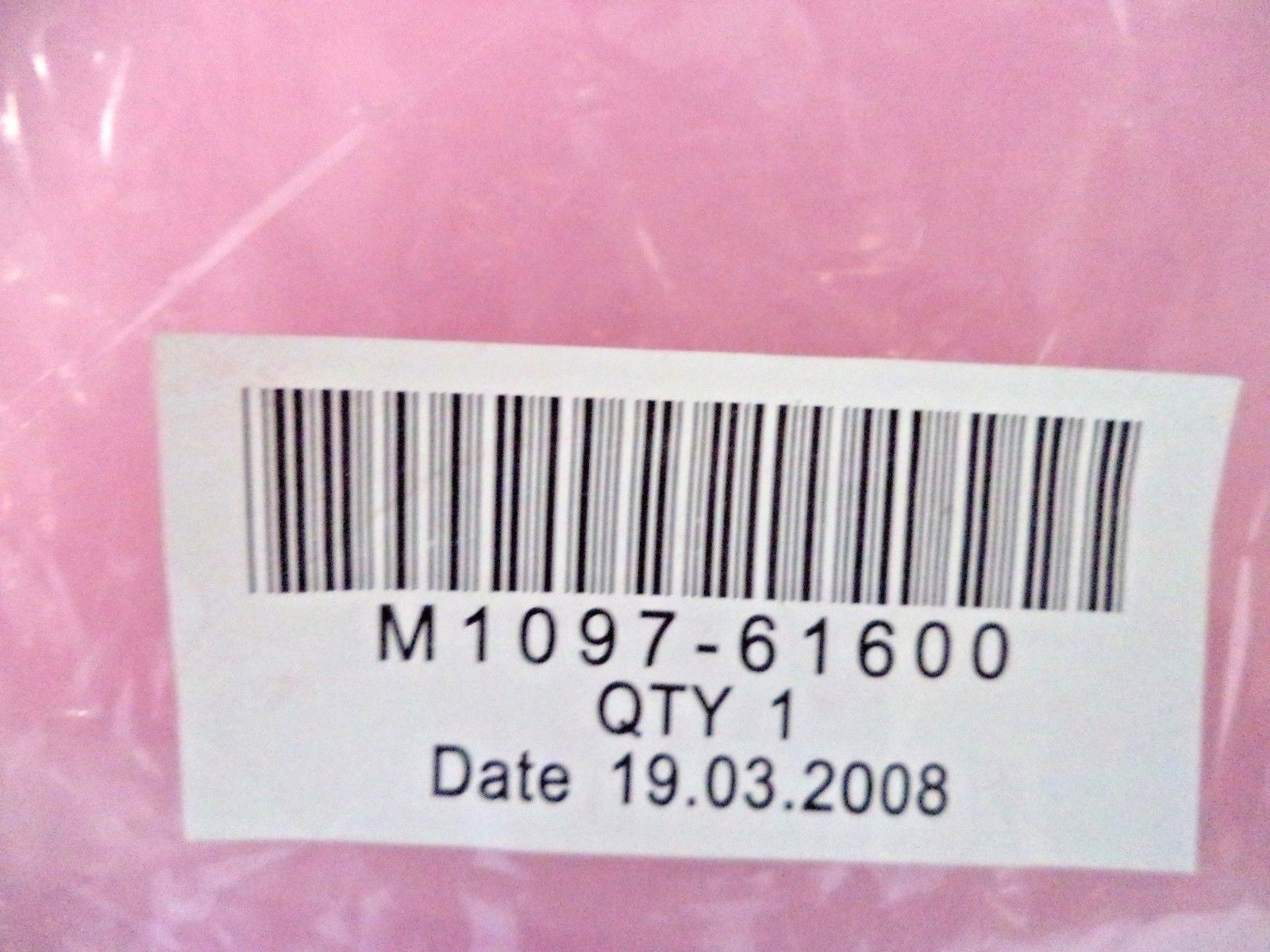 a label on a pink object with a barcode on it