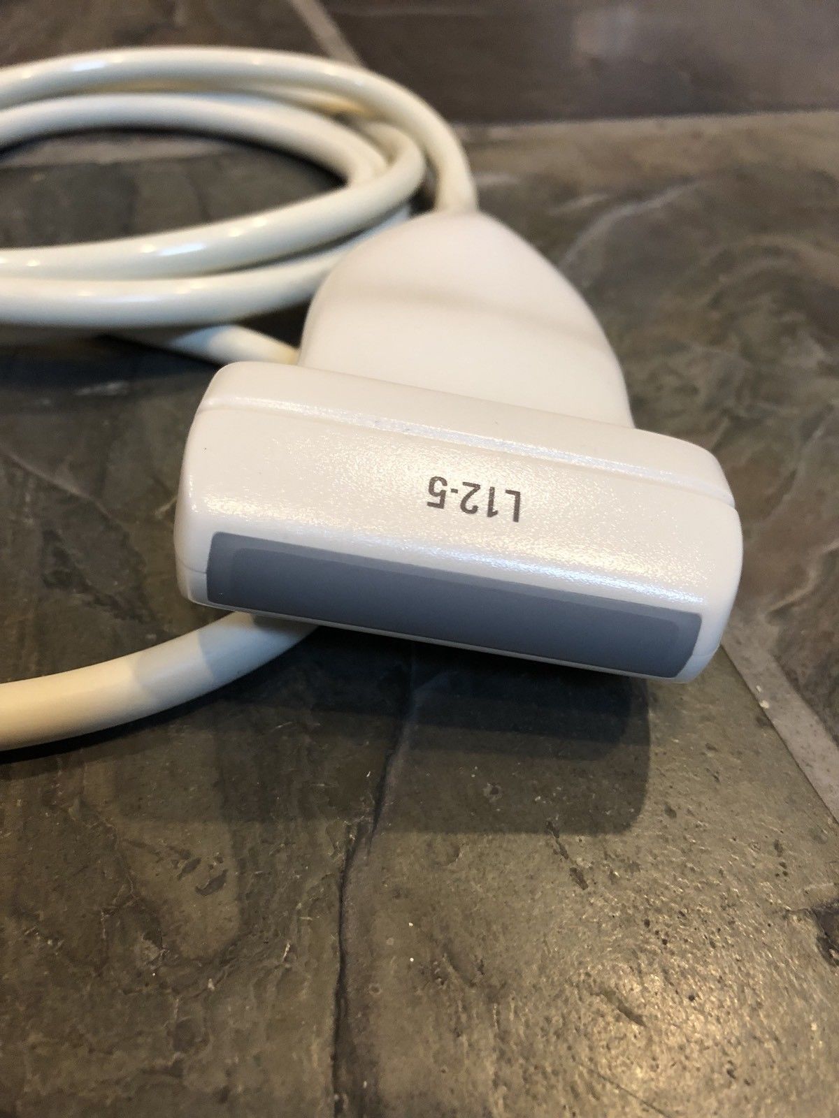 a close up of a white cord connected to a device