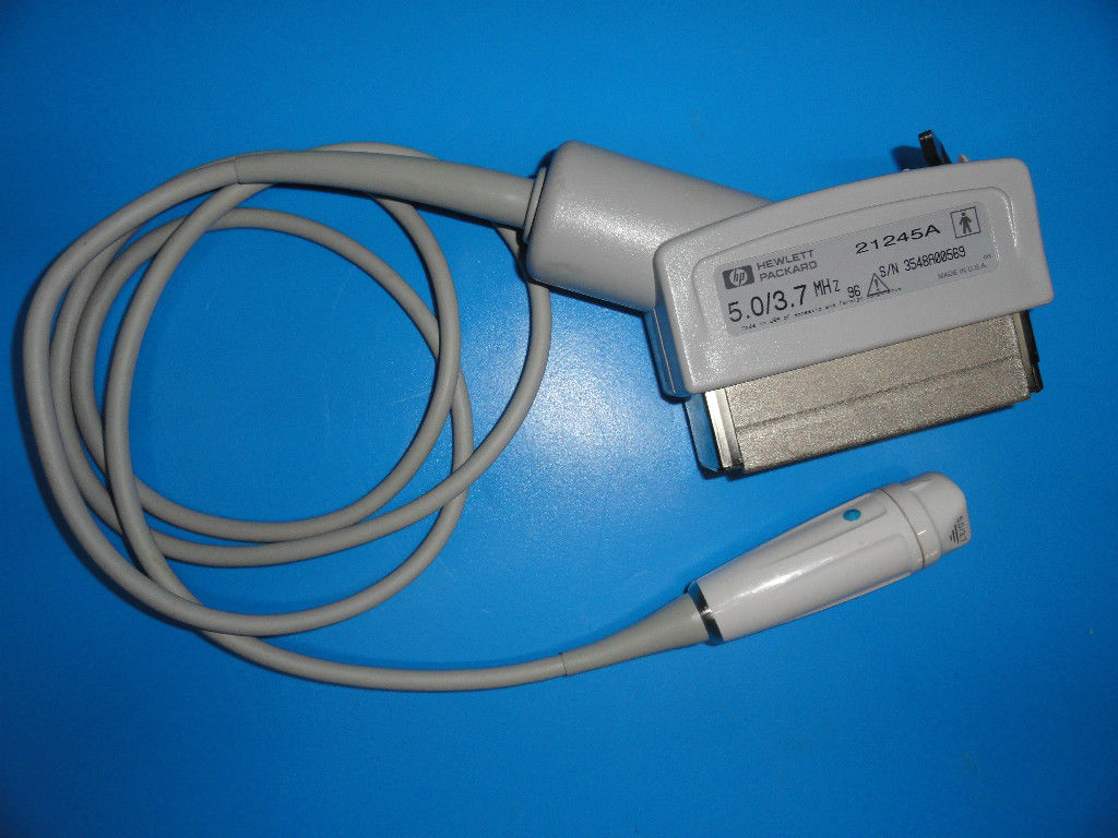 a close up of a charger and a cord on a blue surface