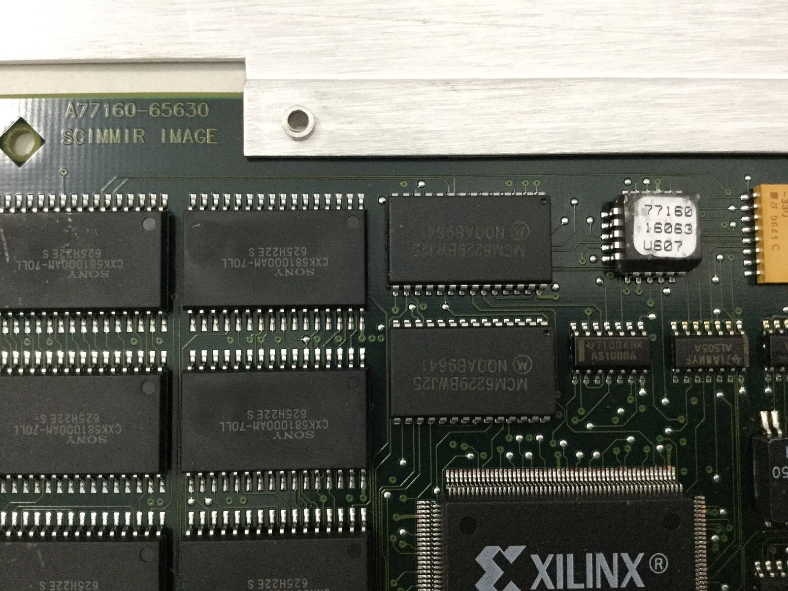 a close up of a computer board with many chips