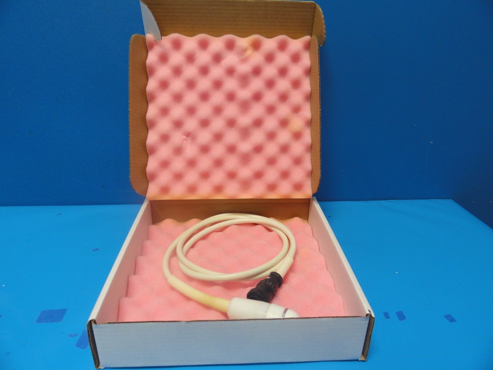 an open box with a probe inside of it