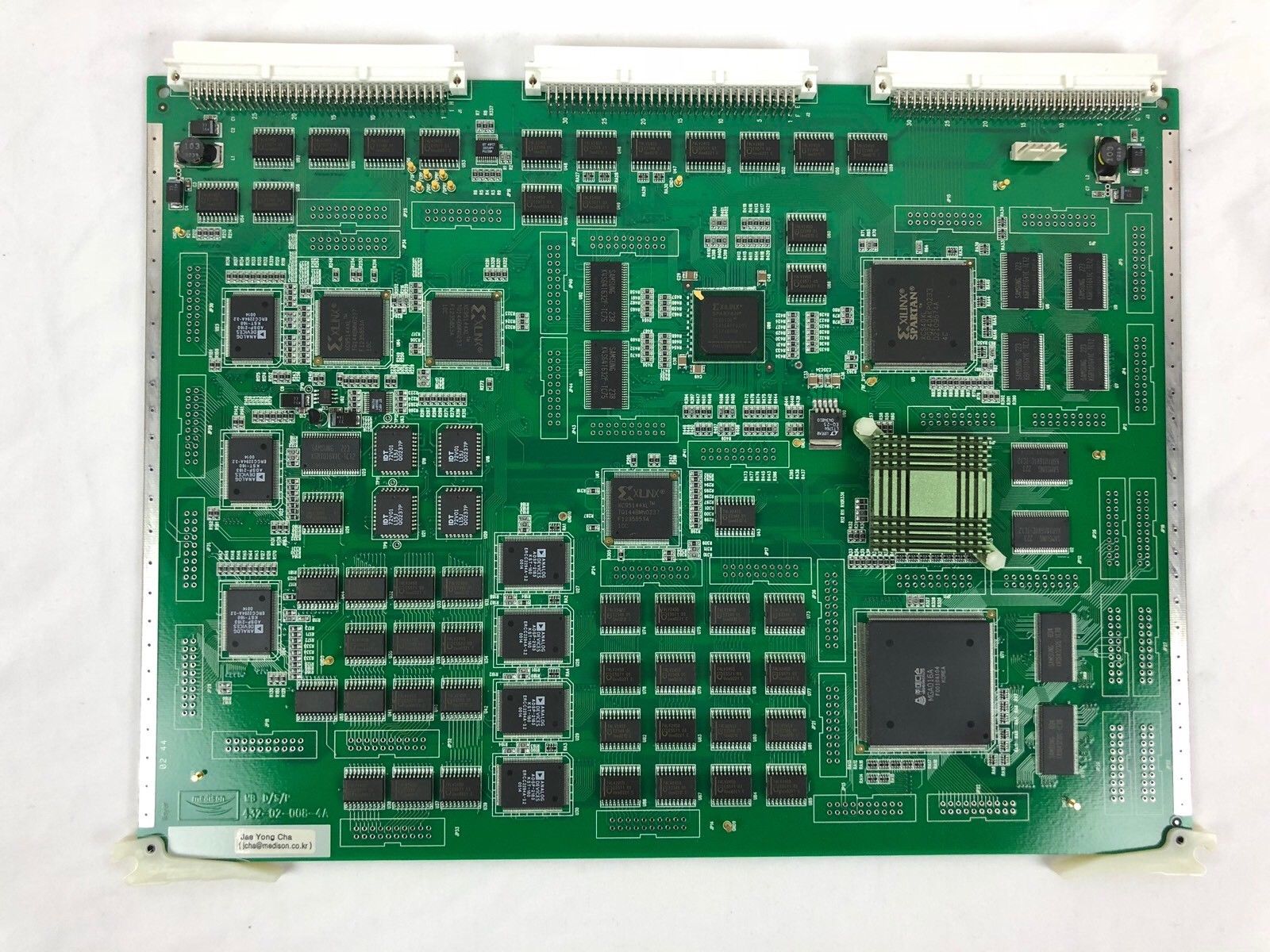 a close up of a green electronic board