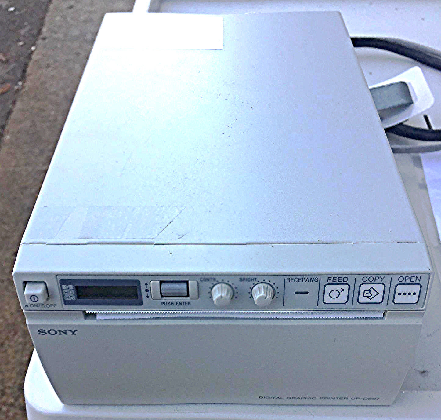 a white printer device sitting on top of a table